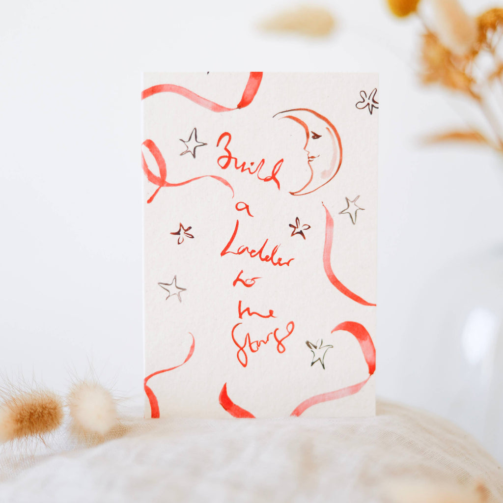 Card with red text and graphics on a white background