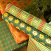 Gift wraps with sunflower design under a Christmas tree