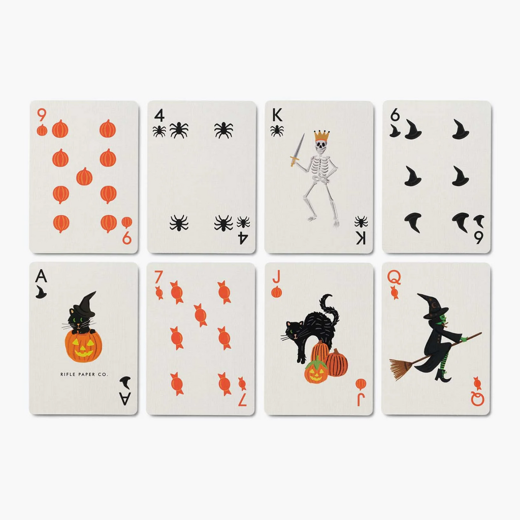Eight Halloween-themed playing cards arranged in a 2x4 grid on a light gray background. The cards feature orange jack-o'-lanterns, black spiders, a skeleton with a crown, flying bats, candy canes, a black cat with a pumpkin, and a witch riding a broomstick.