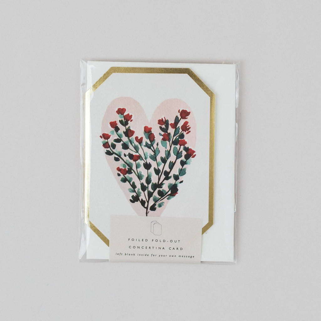 Card with floral heart design on a gray background
