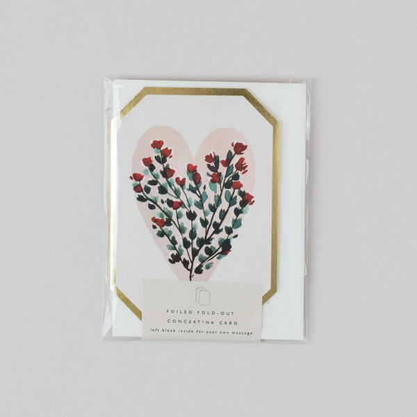 Card with floral heart design on a gray background