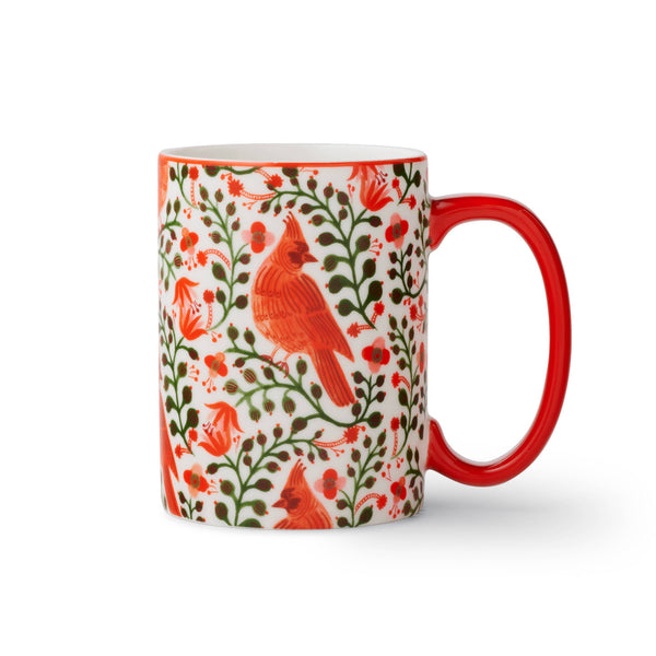 Mug with red cardinal bird and floral pattern on a white background