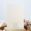 Bar of soap on a wooden stand with a floral background