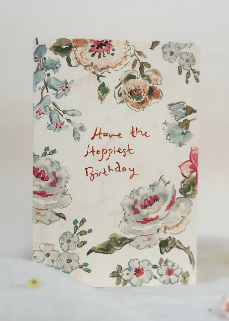 Floral birthday card with decorative text on a white background