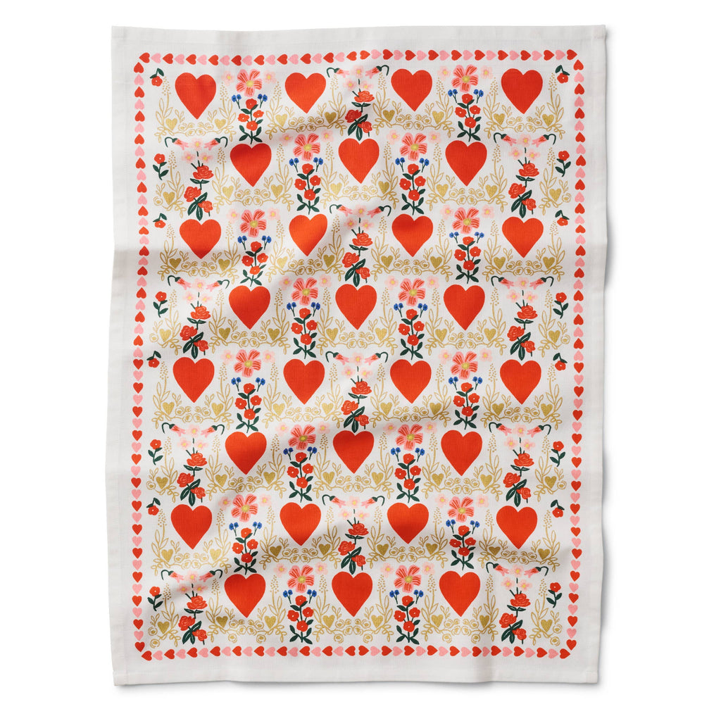 Fabric with red heart and floral pattern on a white background