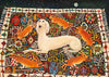 Decorative rug with a white dog and orange rabbits on a colorful geometric pattern.
