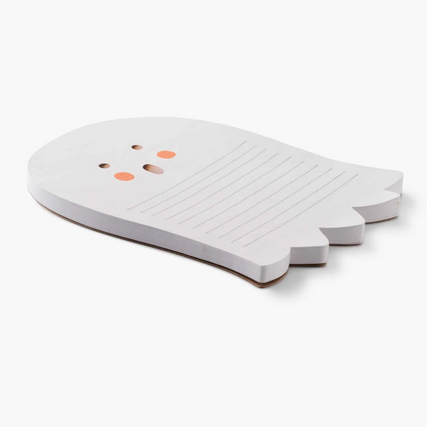 White cutting board shaped like a fish on a white background