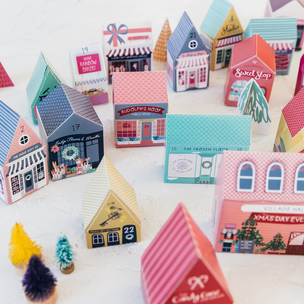 Advent calendar with house-shaped boxes on a white background