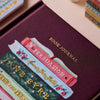 Book-shaped journal with embroidered text on a maroon background