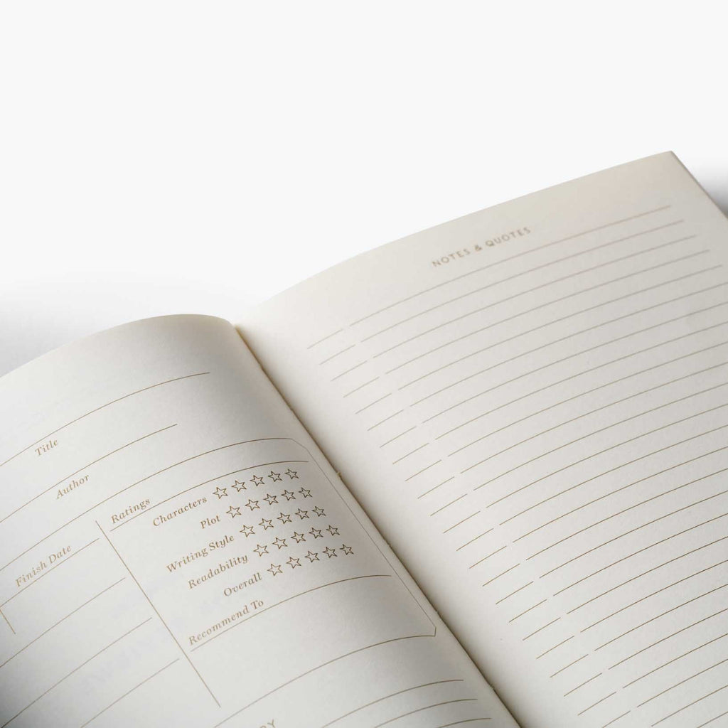 Open notebook with lined pages and printed text on a white background