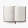 Open notebook with lined pages on a white background